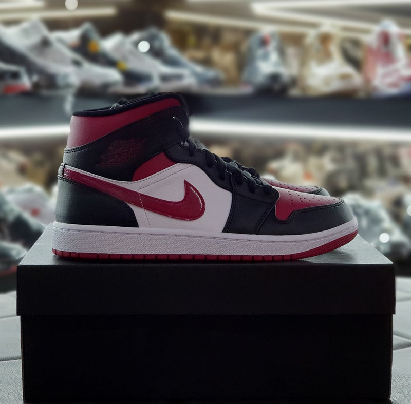 Air Jordan 1 Mid Bred Toe High Top Sneakers