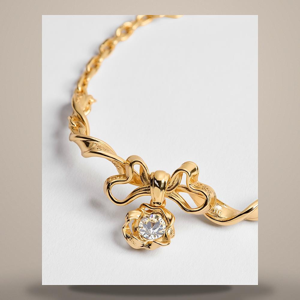 DIOR Gold-Finish Metal Crystal Twist Bow Bracelet B3387WOMCY D319