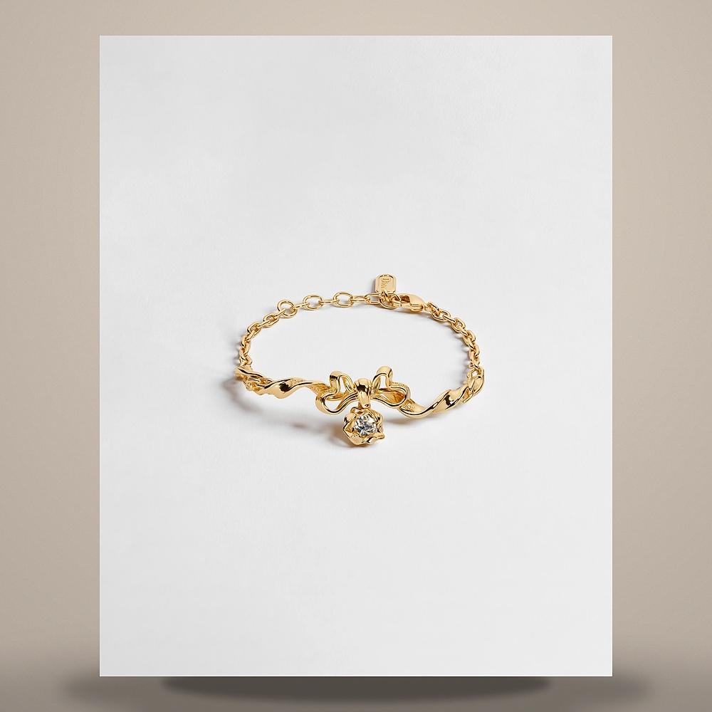 DIOR Gold-Finish Metal Crystal Twist Bow Bracelet B3387WOMCY D319